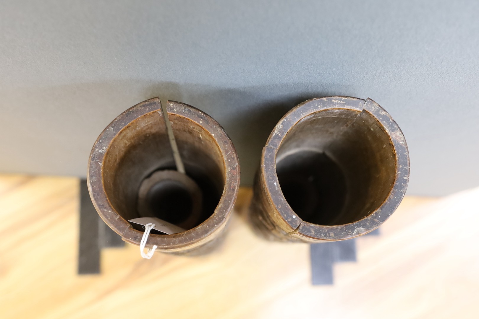 A pair of early 20th century Chinese carved bamboo chutes, 70cm